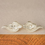 Cloud earrings displayed as a pair