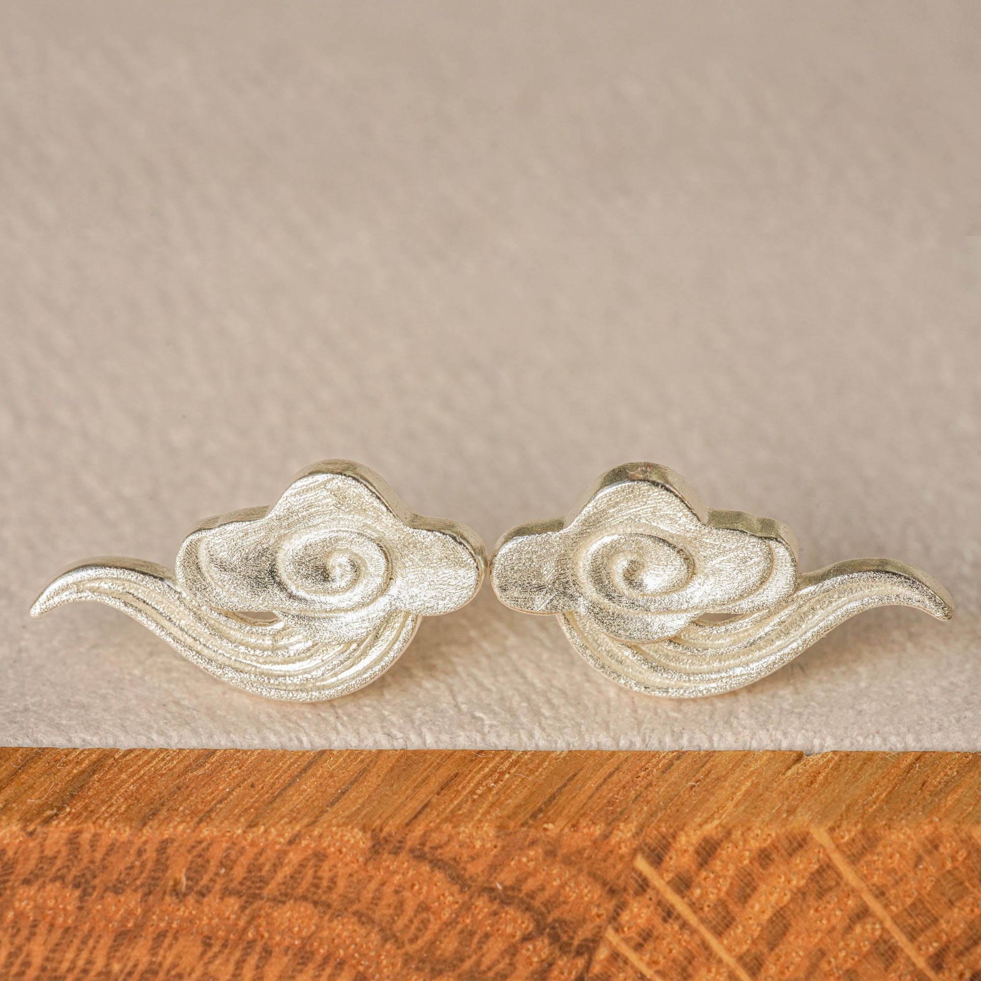 Cloud earrings displayed as a pair