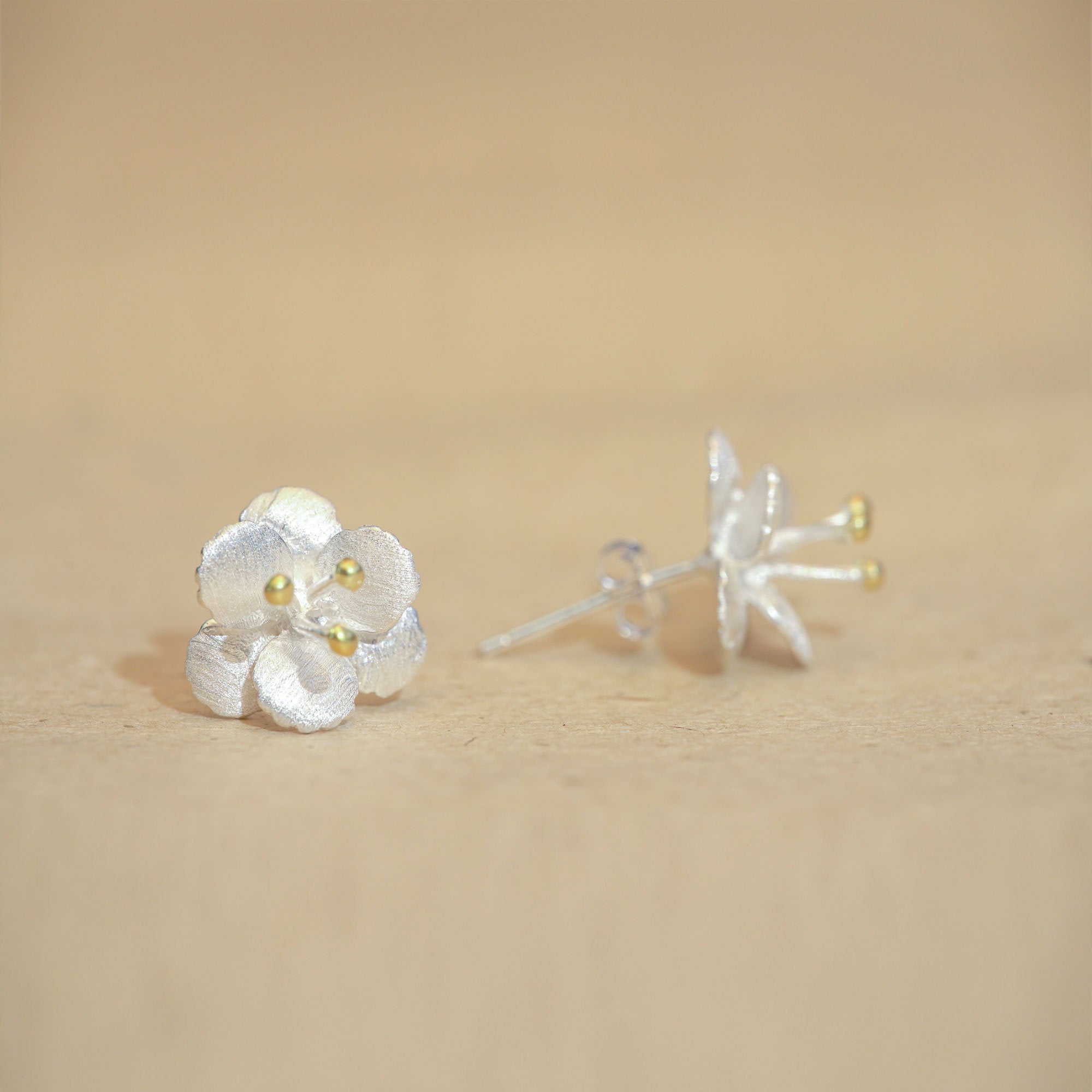 Crab apple earrings showing handmade jewelry details