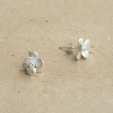 Crab apple flower earrings displayed as a pair
