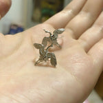 Crane bird stud earrings displayed as a pair