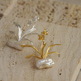 Daffodils brooch styled as botanical jewelry