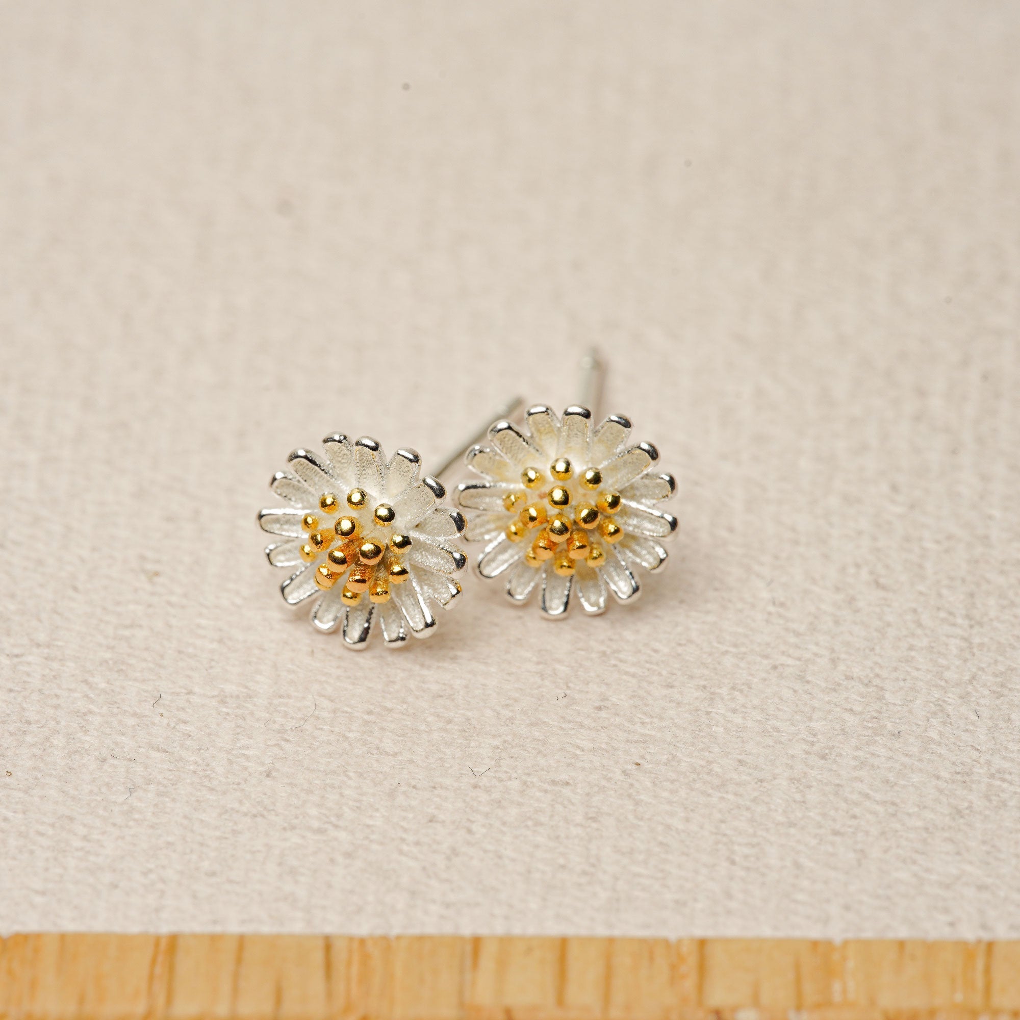 Daisy flower earrings showing handmade details