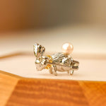 Detailed view of Alice rabbit brooch