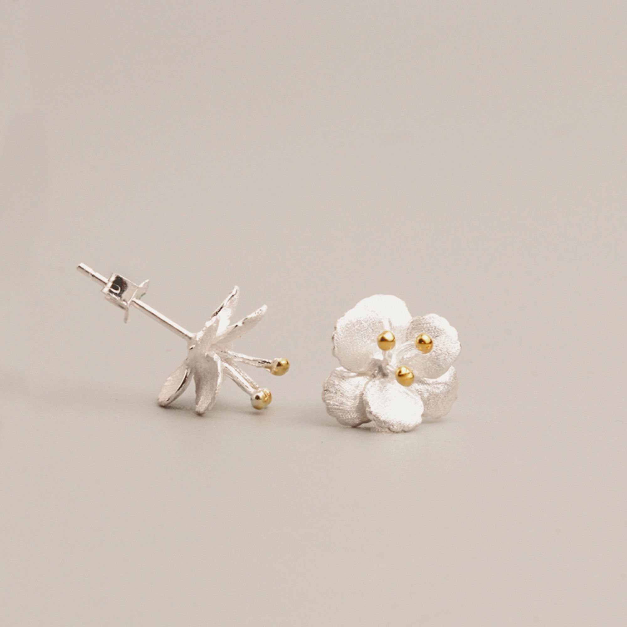 Detailed view of crab apple flower earrings