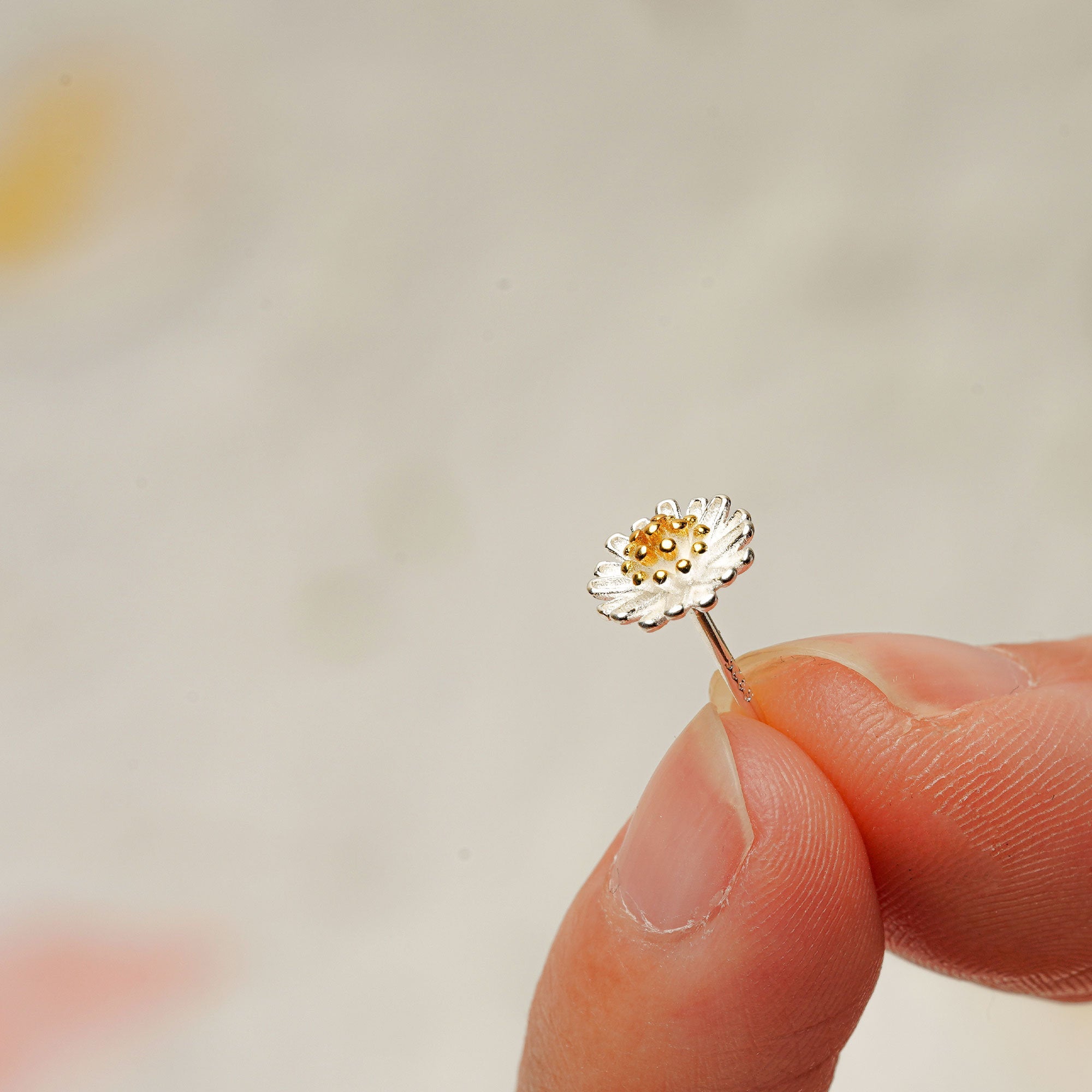 Detailed view of daisy earrings