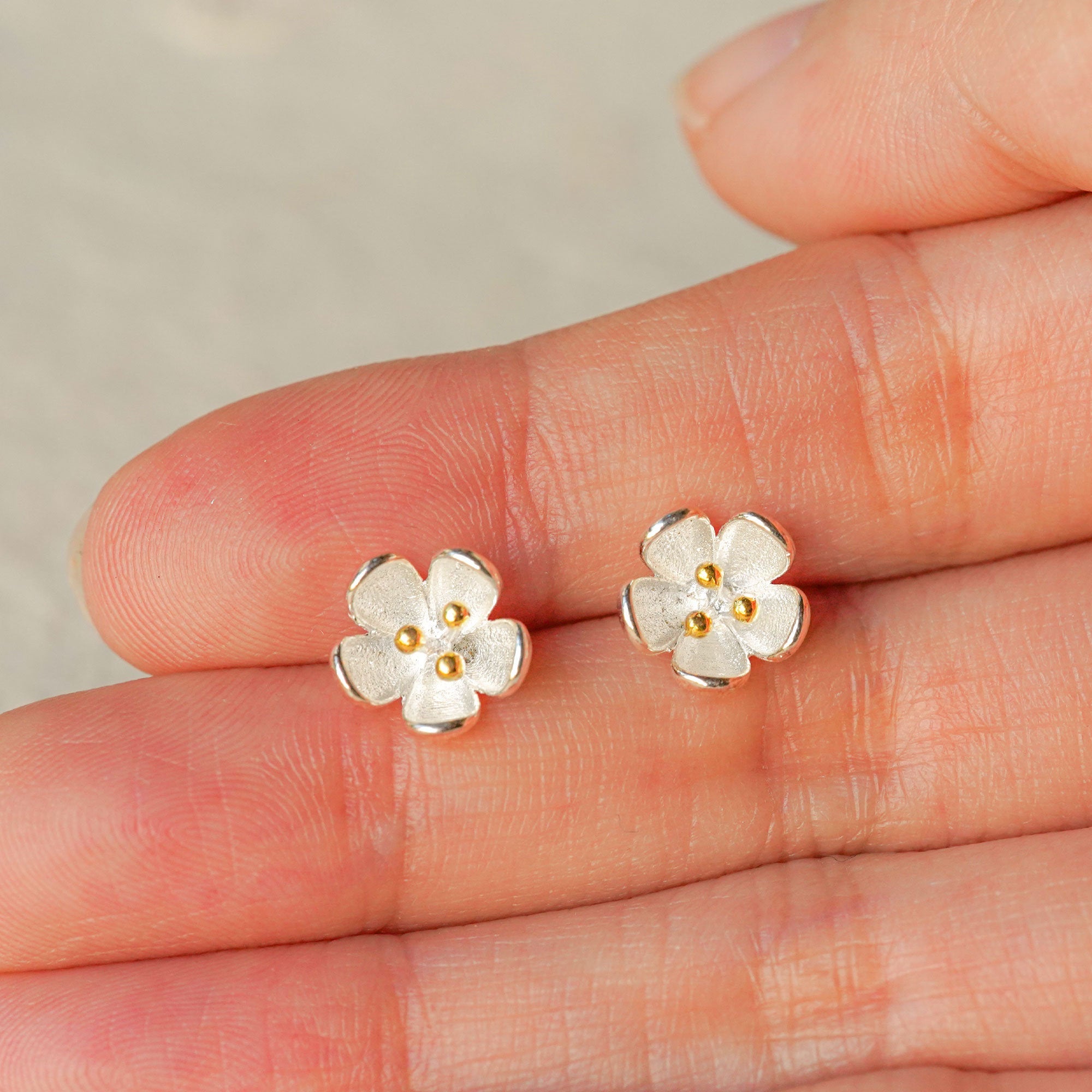 Detailed view of flower stud earrings