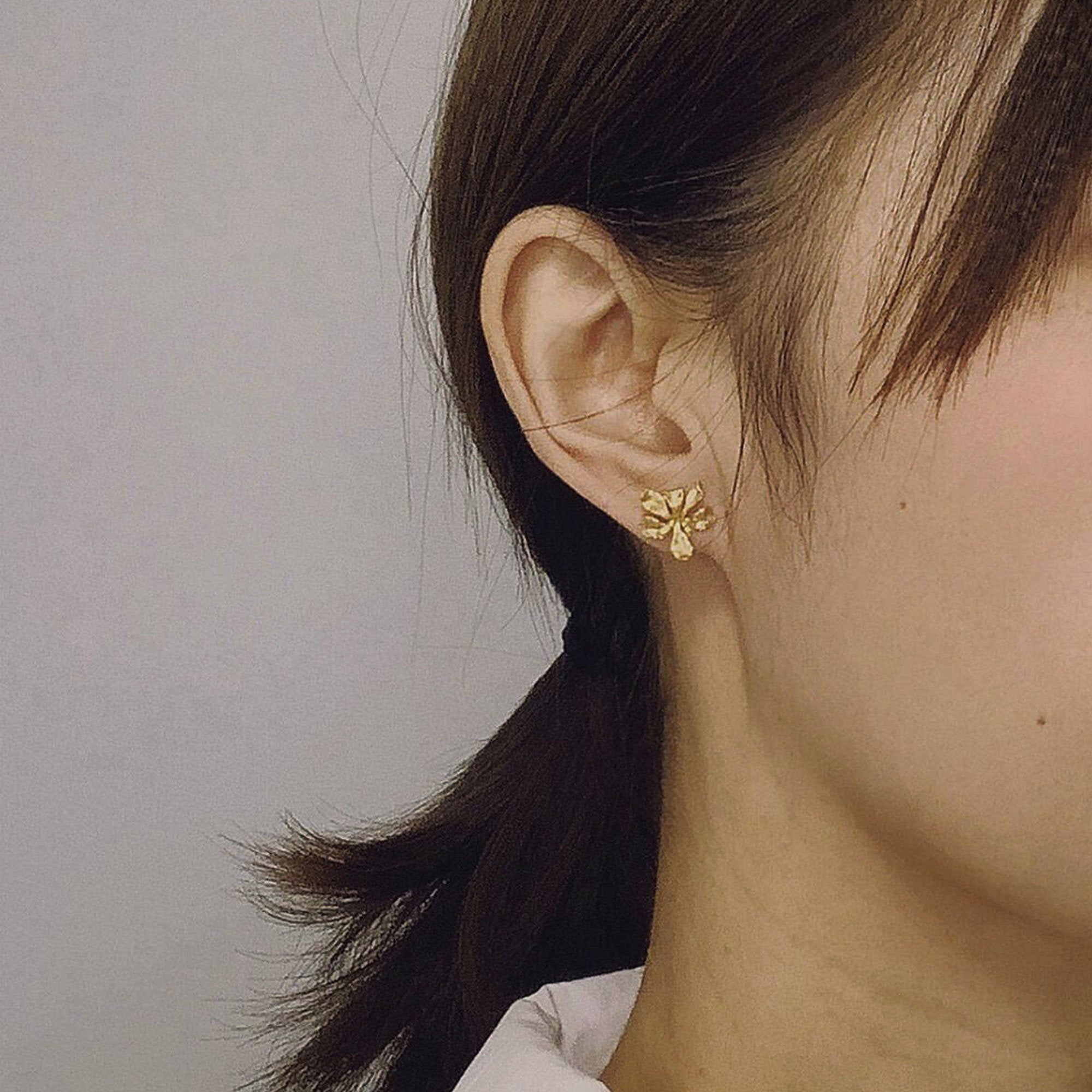 Detailed view of iris earring studs