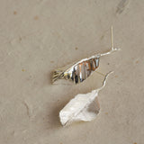 Detailed view of leaf drop earrings