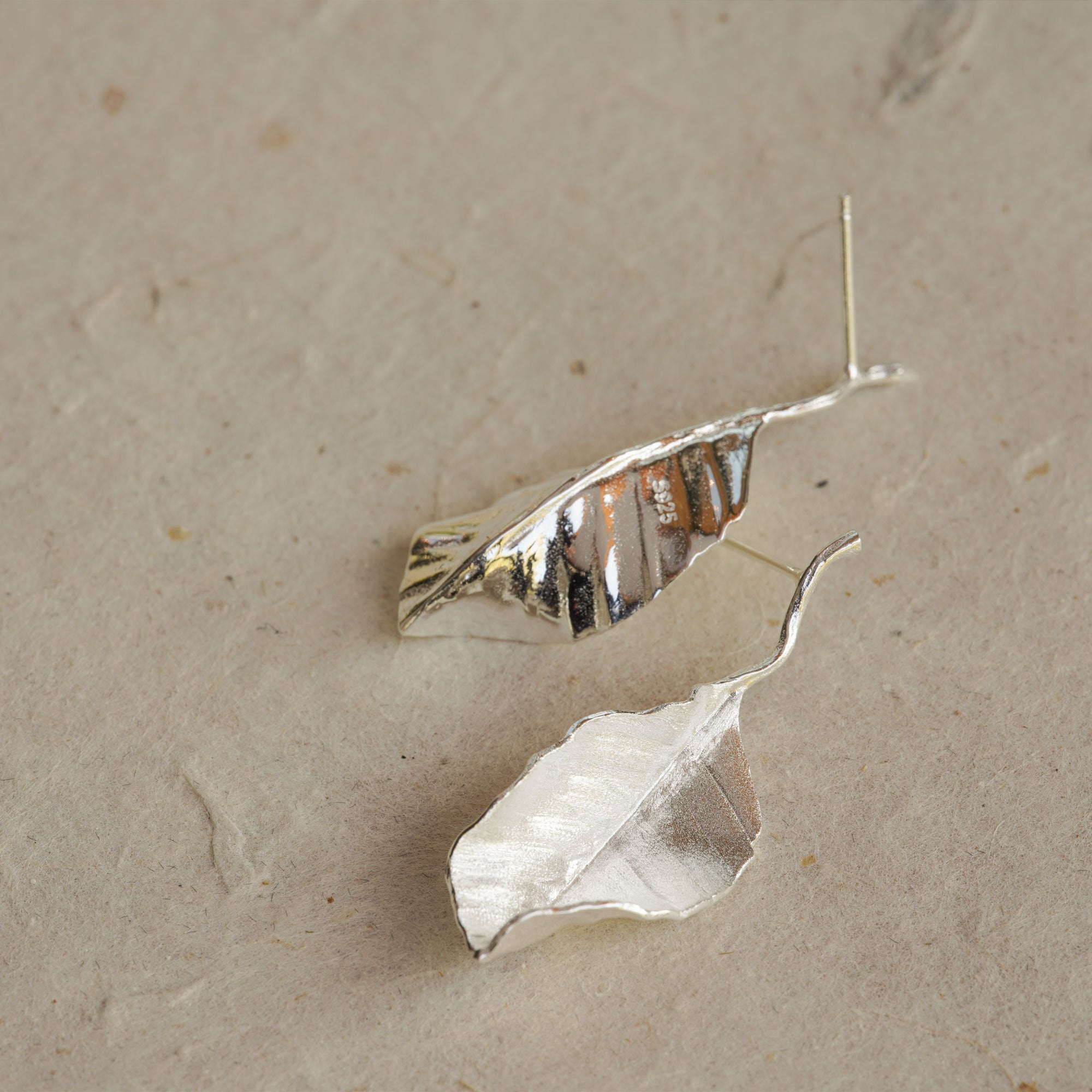 Detailed view of leaf drop earrings