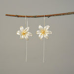 Detailed view of lily drop earrings