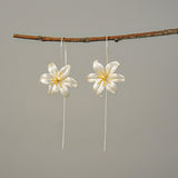 Detailed view of lily drop earrings