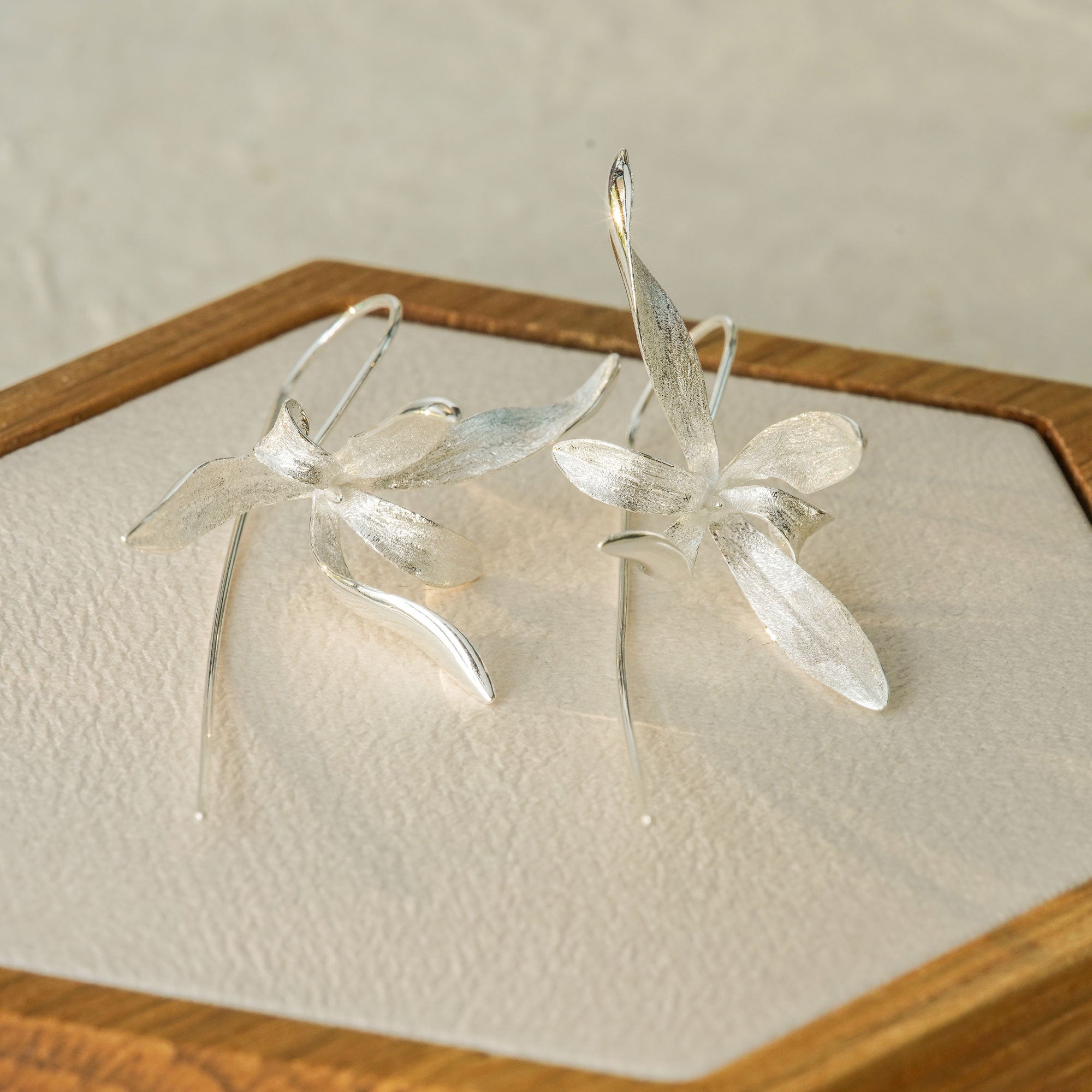 Detailed view of orchid earrings