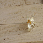 Detailed view of osmanthus brooch