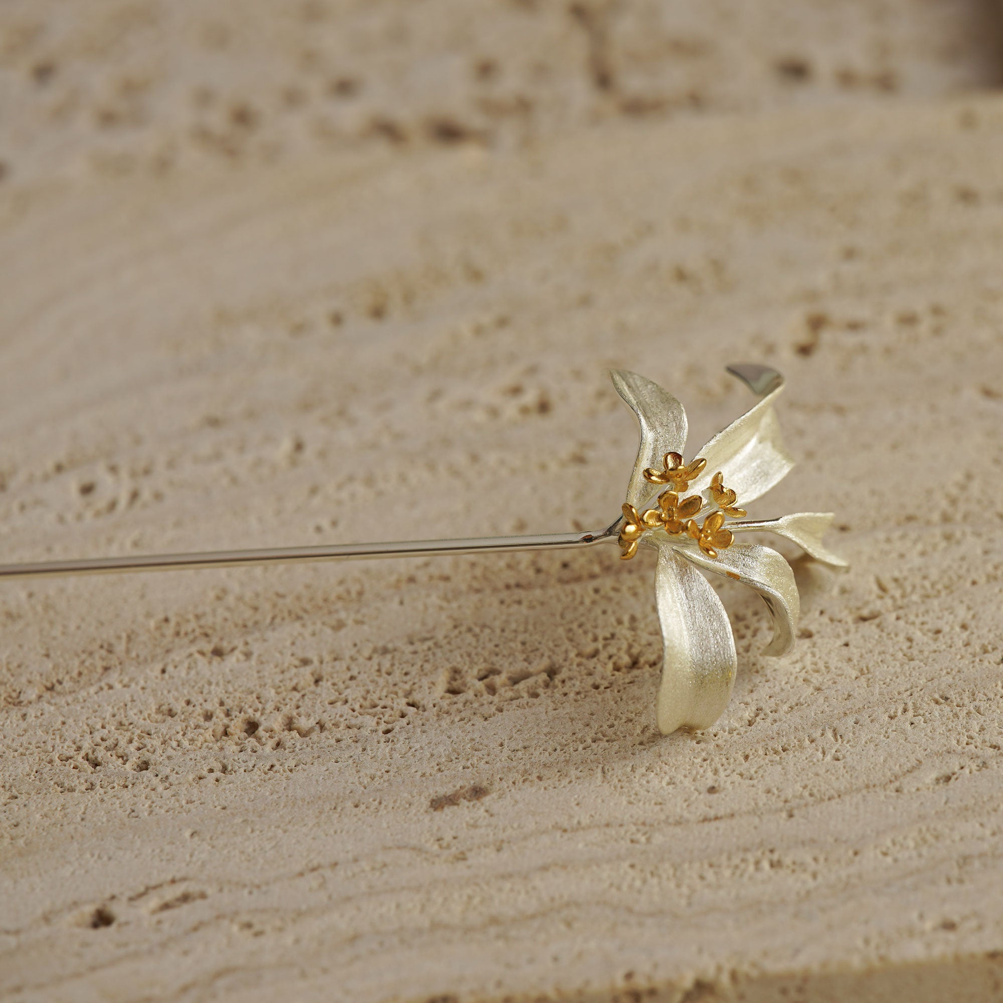 Detailed view of osmanthus brooch