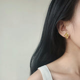 Detailed view of osmanthus flower earrings