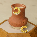 Detailed view of pencil earrings
