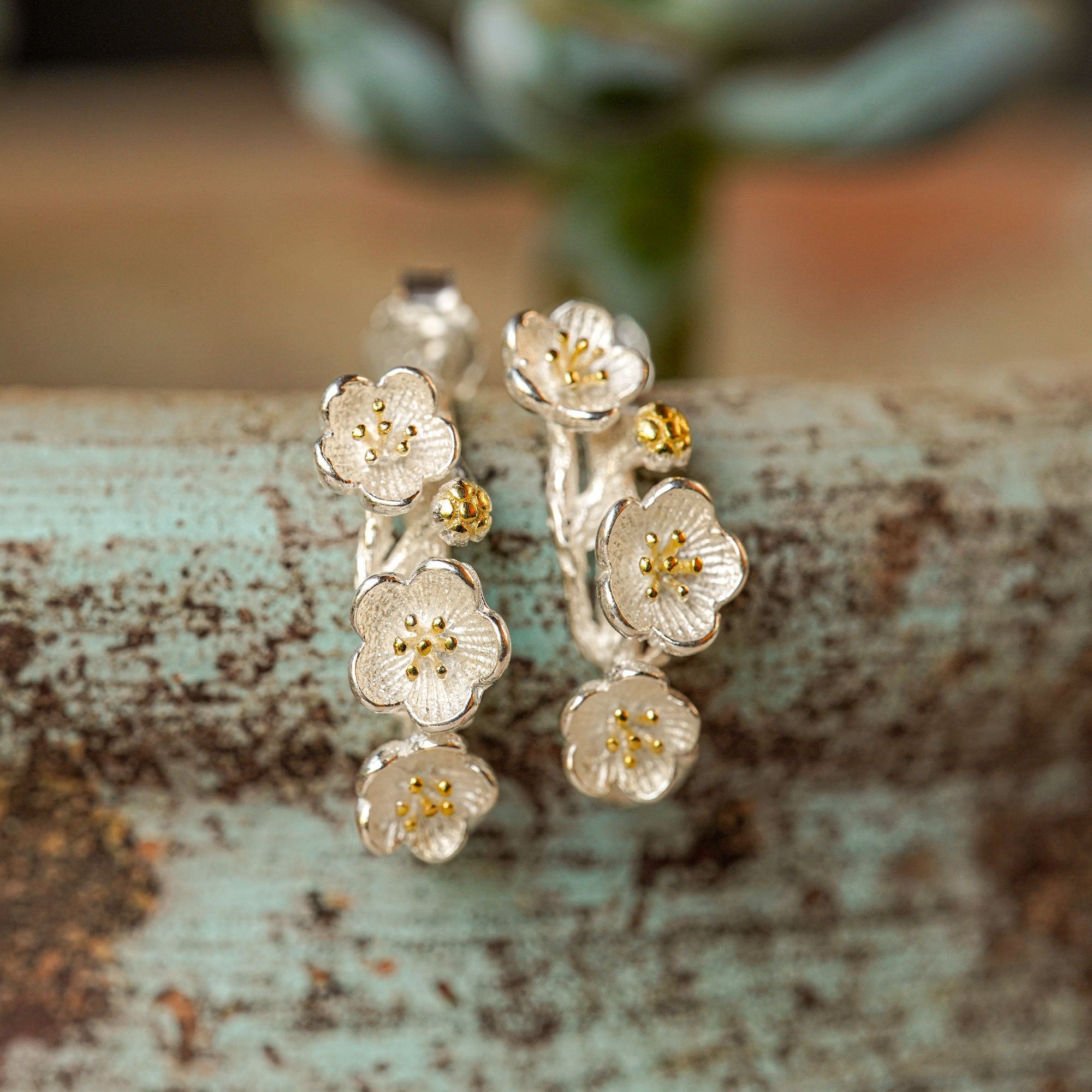 Detailed view of plum blossom flower earrings