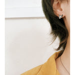Detailed view of sphinx cat earrings