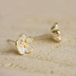 Flower stud earrings displayed as a pair