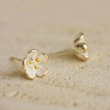 Flower stud earrings displayed as a pair