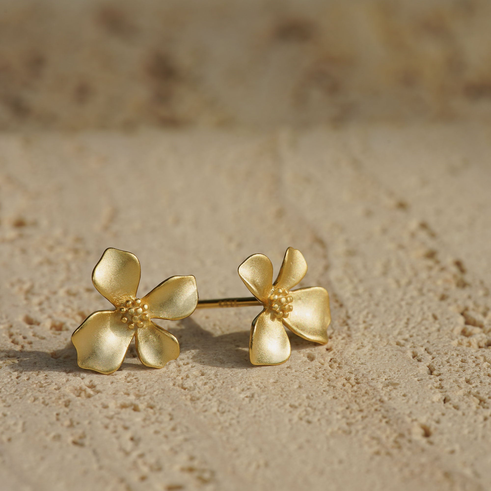 Gardenia flower earrings displayed as a pair