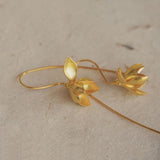 Gold flower drop earrings inspired by magnolia blossoms