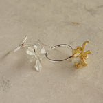 Iris floral ring displayed on neutral background