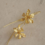 Iris flower earrings showing handmade jewelry details