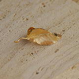 Leaf brooch styled as nature inspired jewelry
