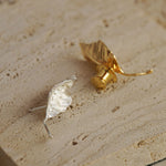 Leaf brooch displayed on neutral background