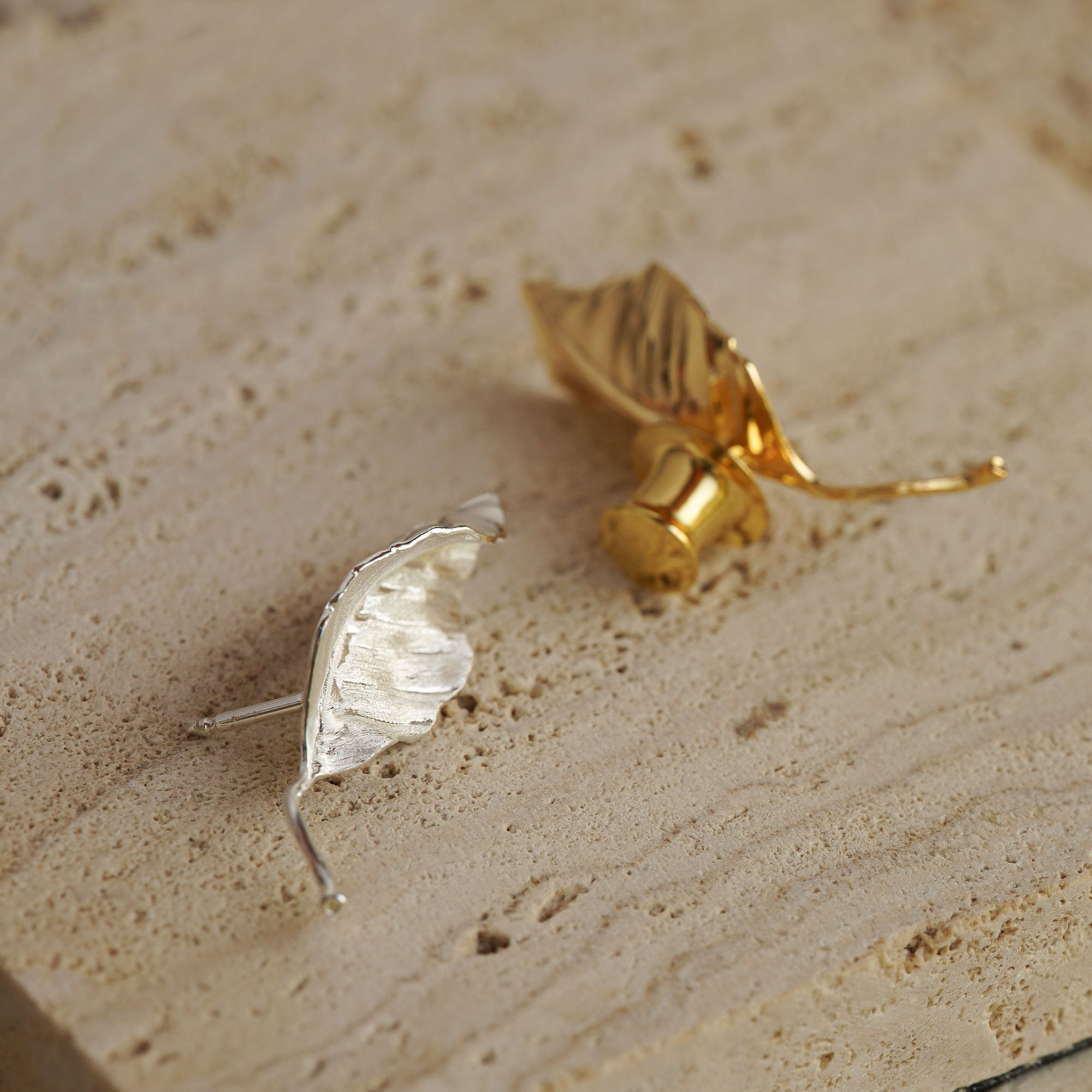 Leaf brooch displayed on neutral background