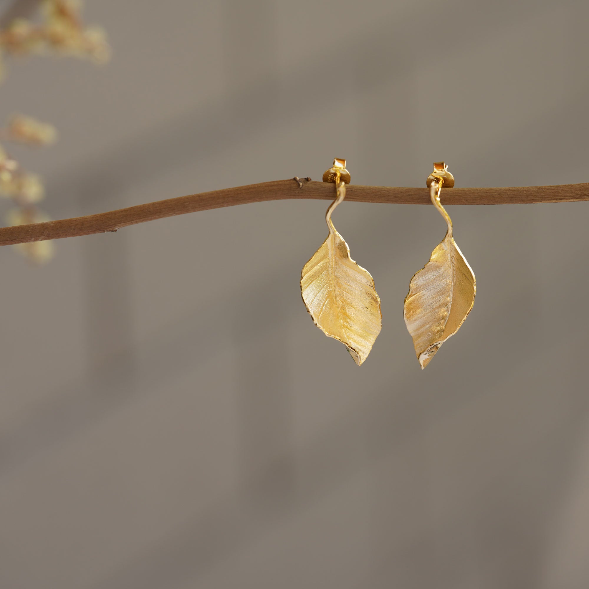 Leaf drop earrings showing handmade jewelry details