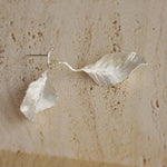 Leaf drop earrings styled as nature inspired jewelry