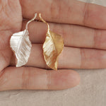 Leaf drop earrings displayed as a pair