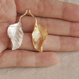 Leaf drop earrings displayed as a pair