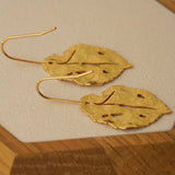 Leaf earrings showing handmade jewelry details
