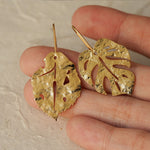 Leaf earrings displayed as a pair