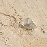 Leaf pendant necklace showing handmade jewelry details