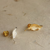 Leaf pin showing handmade jewelry details
