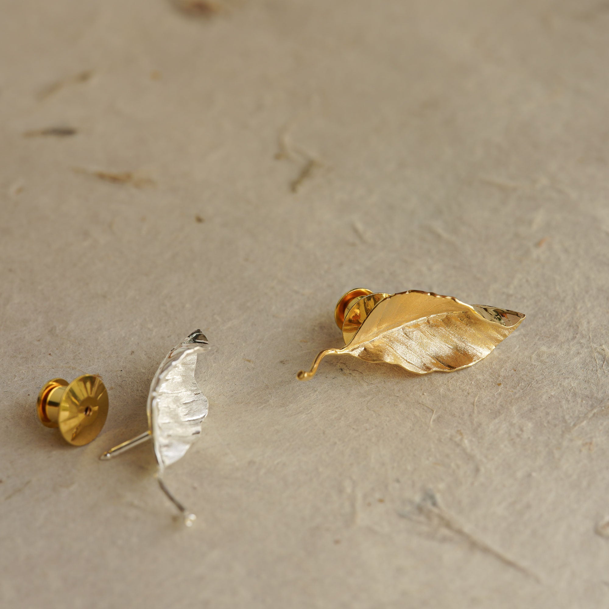 Leaf pin showing handmade jewelry details