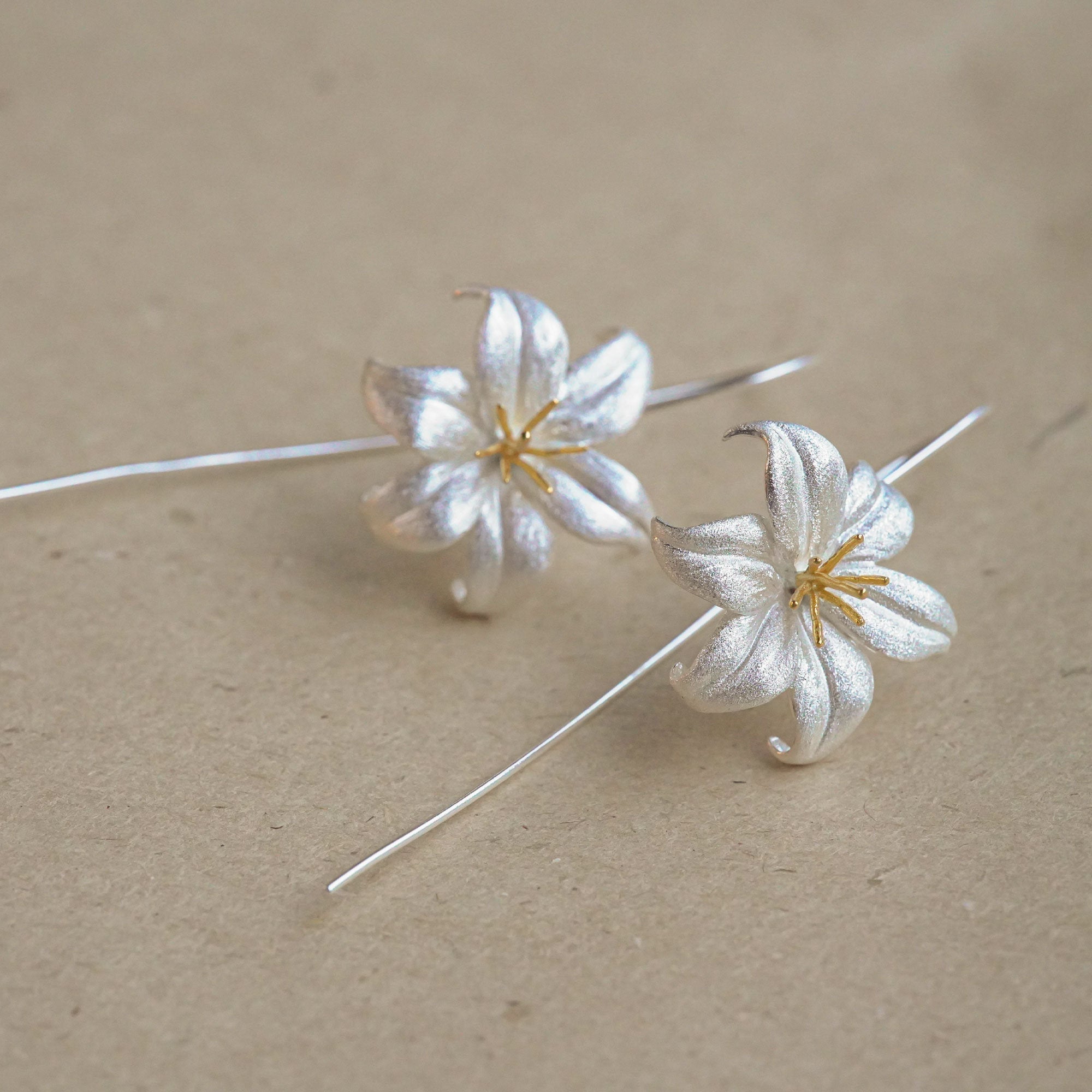 Lily drop earrings with delicate flower design