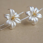 Lily drop earrings displayed as a pair