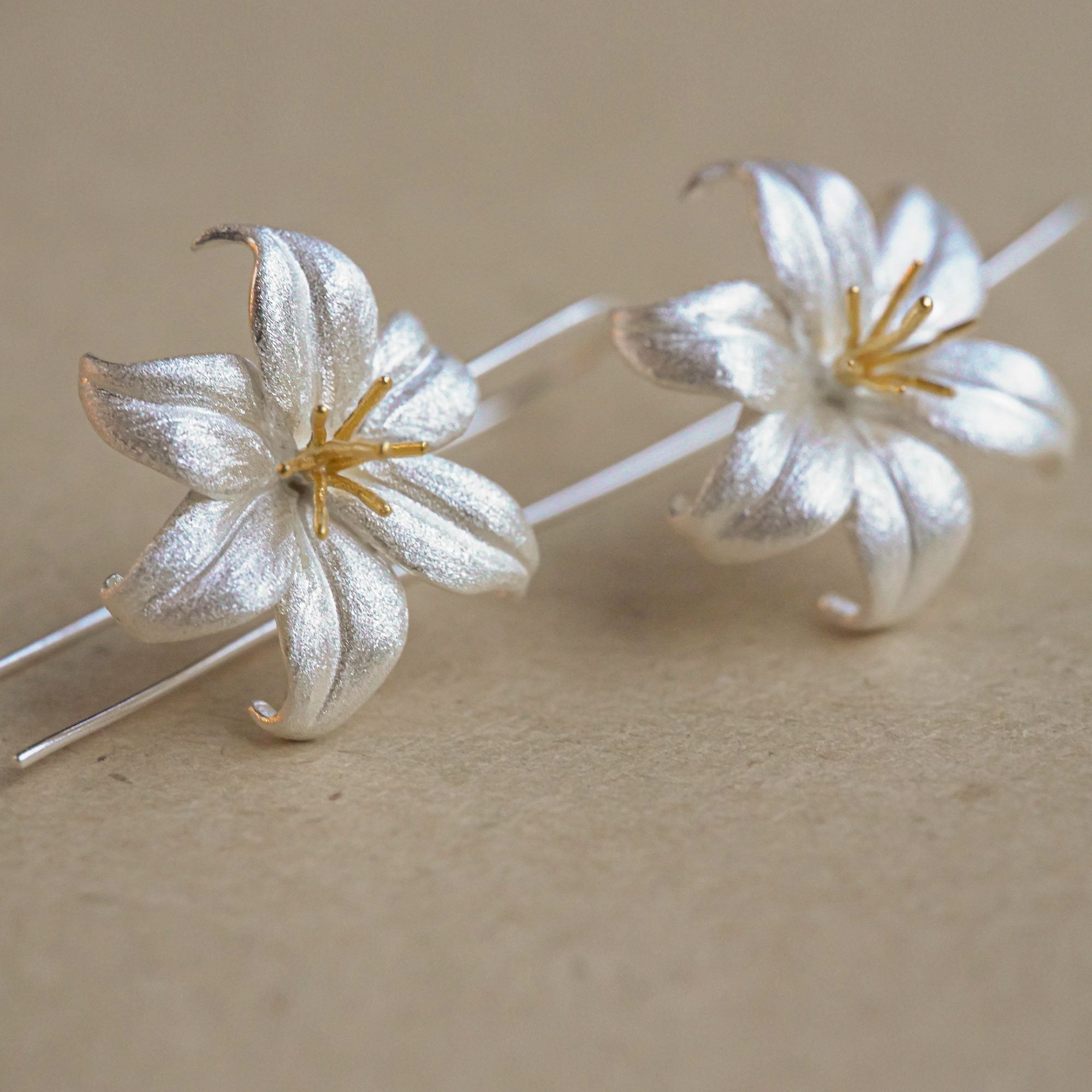 Lily drop earrings displayed as a pair