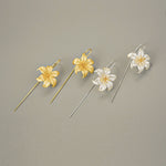 Lily flower drop earrings showing handmade details