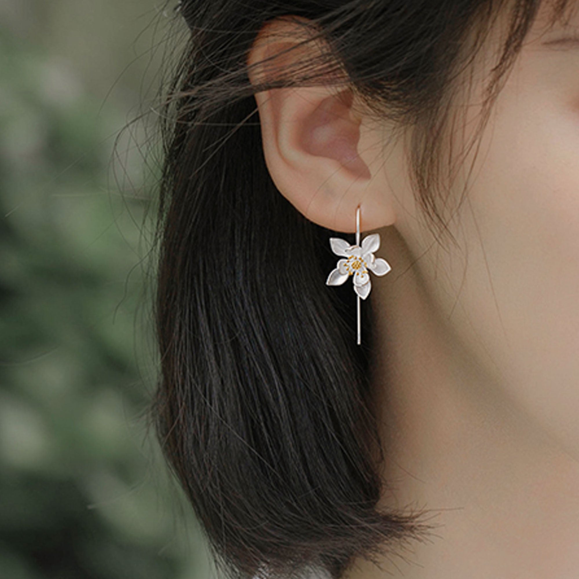 Lotus earrings styled as nature inspired jewelry