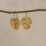 Monstera leaf earrings showing handmade details
