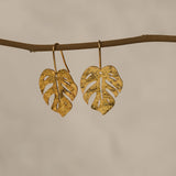 Monstera leaf earrings showing handmade details