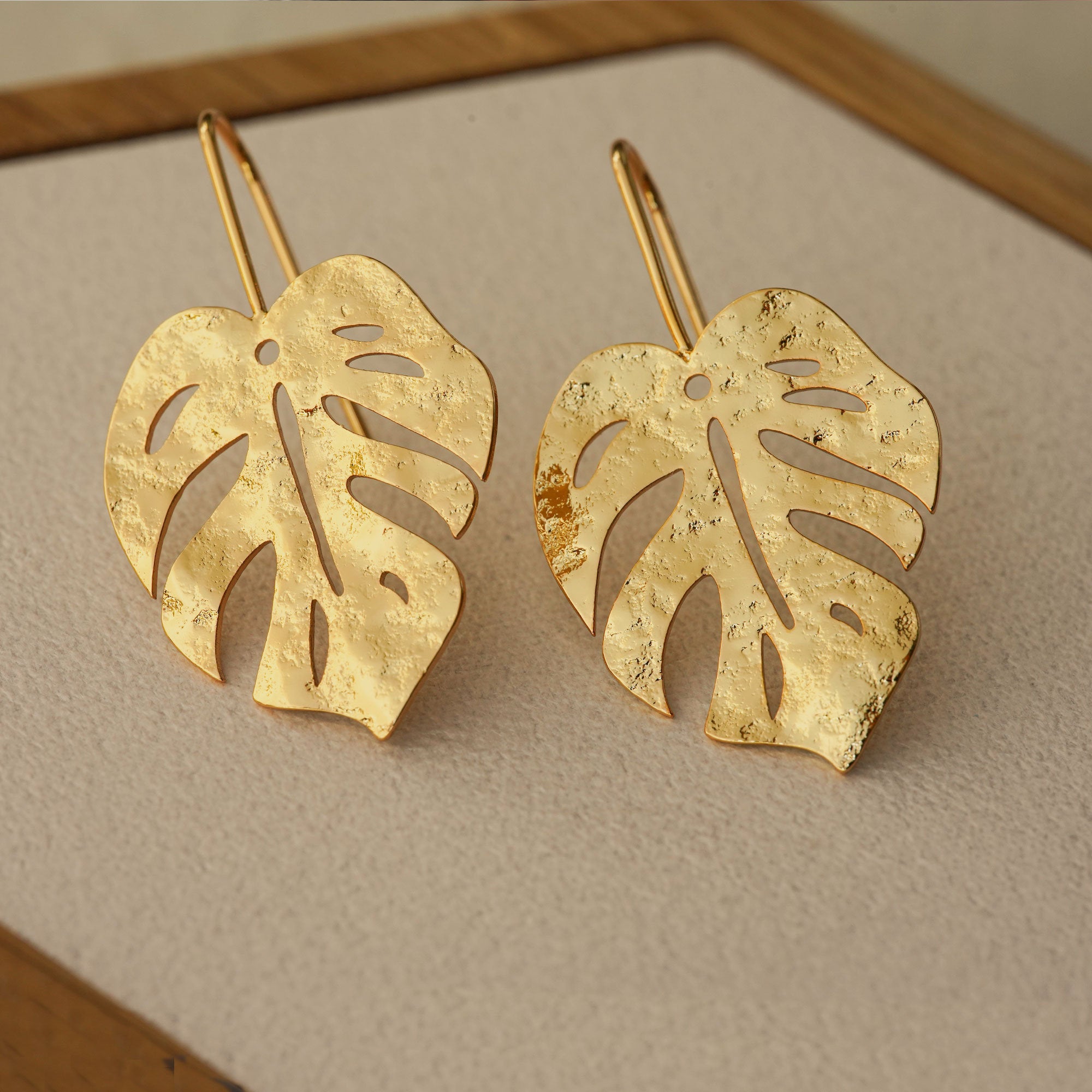 Monstera leaf earrings with tropical leaf design