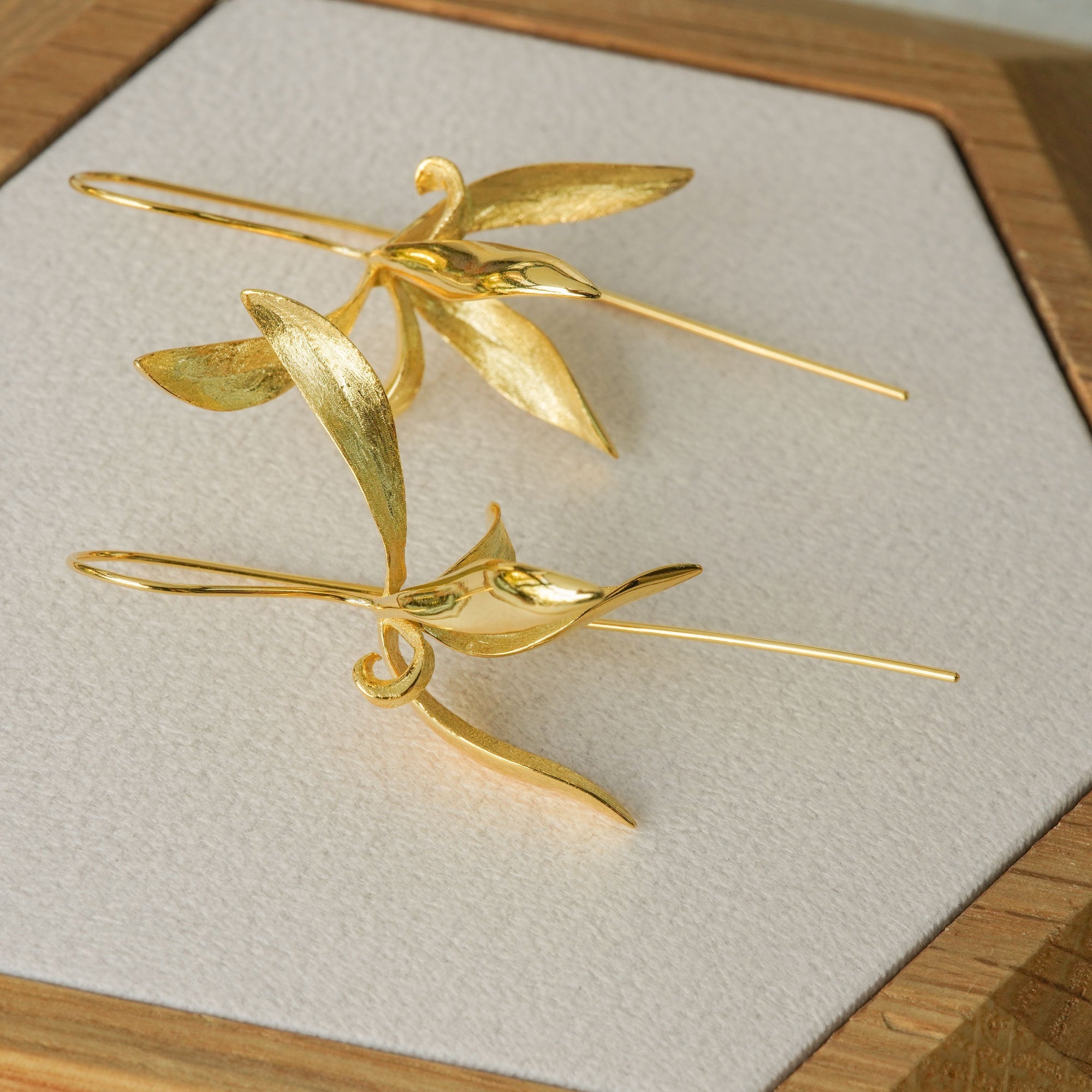 Orchid earrings styled as botanical jewelry